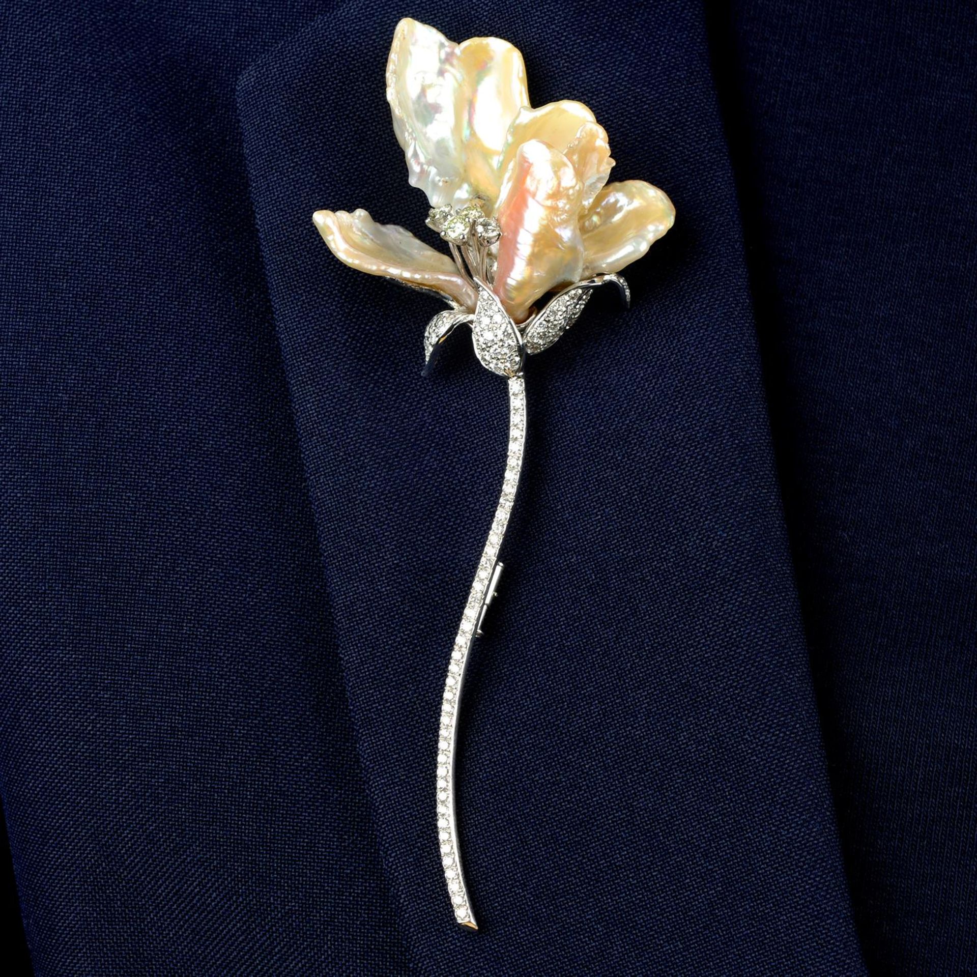 A baroque cultured pearl, 'yellow' diamond and diamond floral brooch.