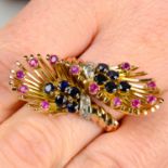 A mid 20th century gold, sapphire, ruby and diamond crossover ring.