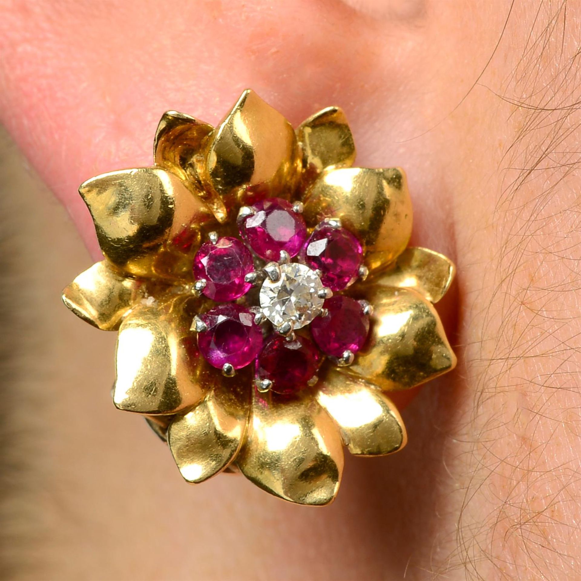 A pair of mid 20th century gold, circular-cut diamond and ruby floral cluster earrings.