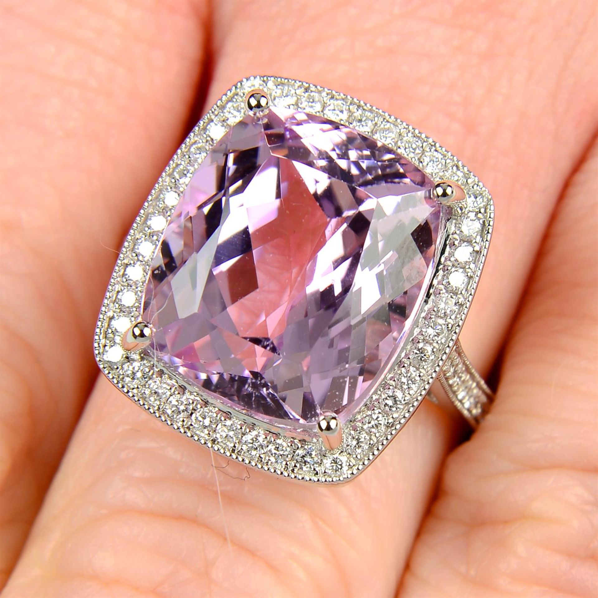 An 18ct gold kunzite and brilliant-cut diamond cluster ring.