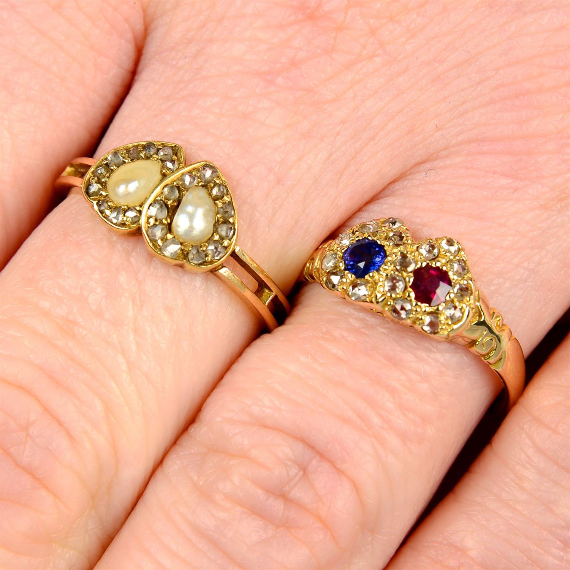 Two late 19th century gold gem-set double heart rings.