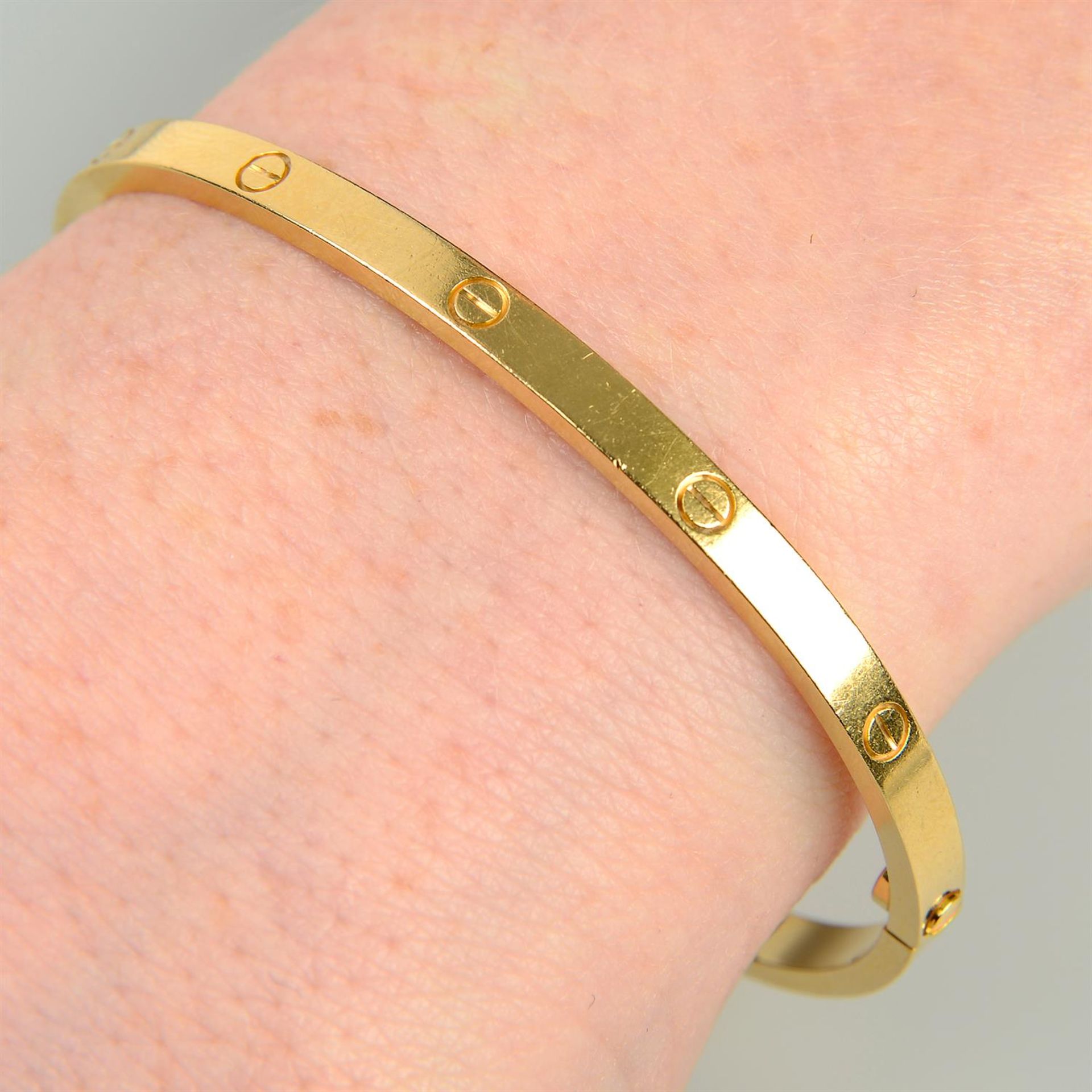 An 18ct gold 'Love' bangle, by Cartier.