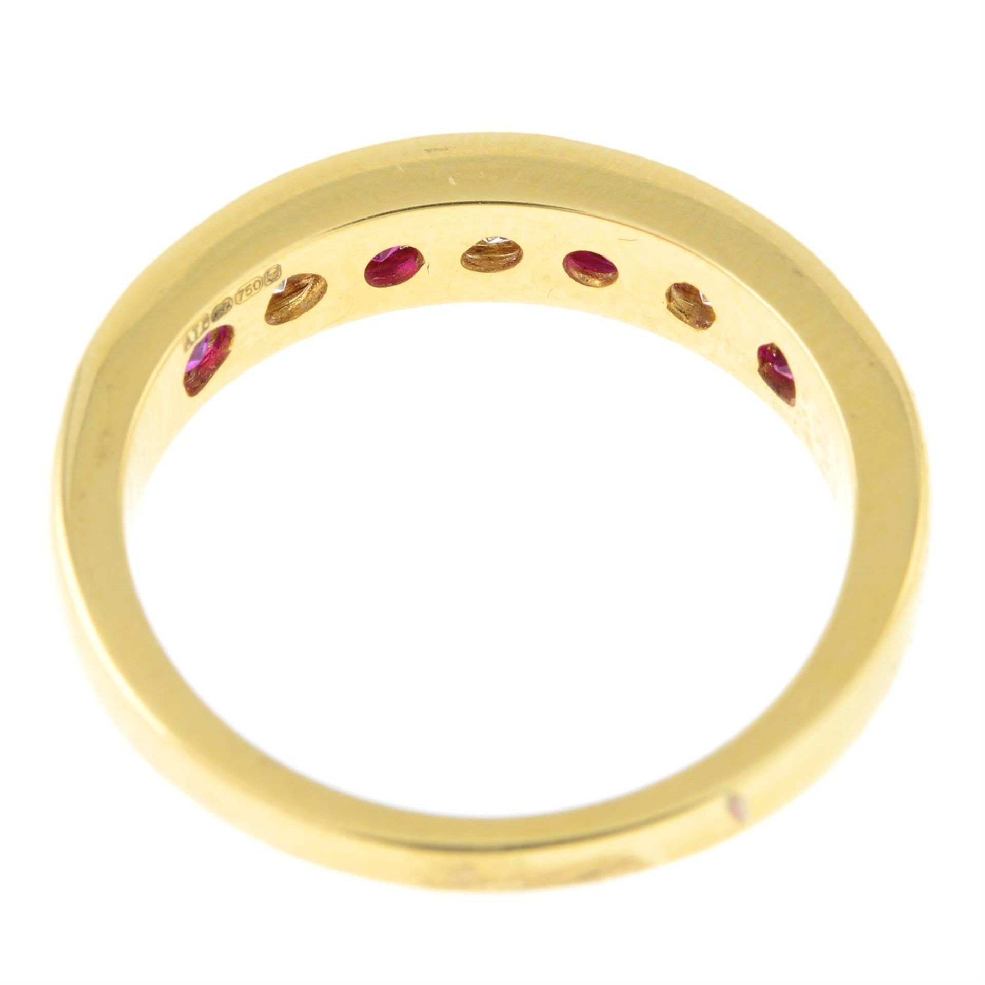 An 18ct gold ruby and diamond half eternity ring. - Image 2 of 2