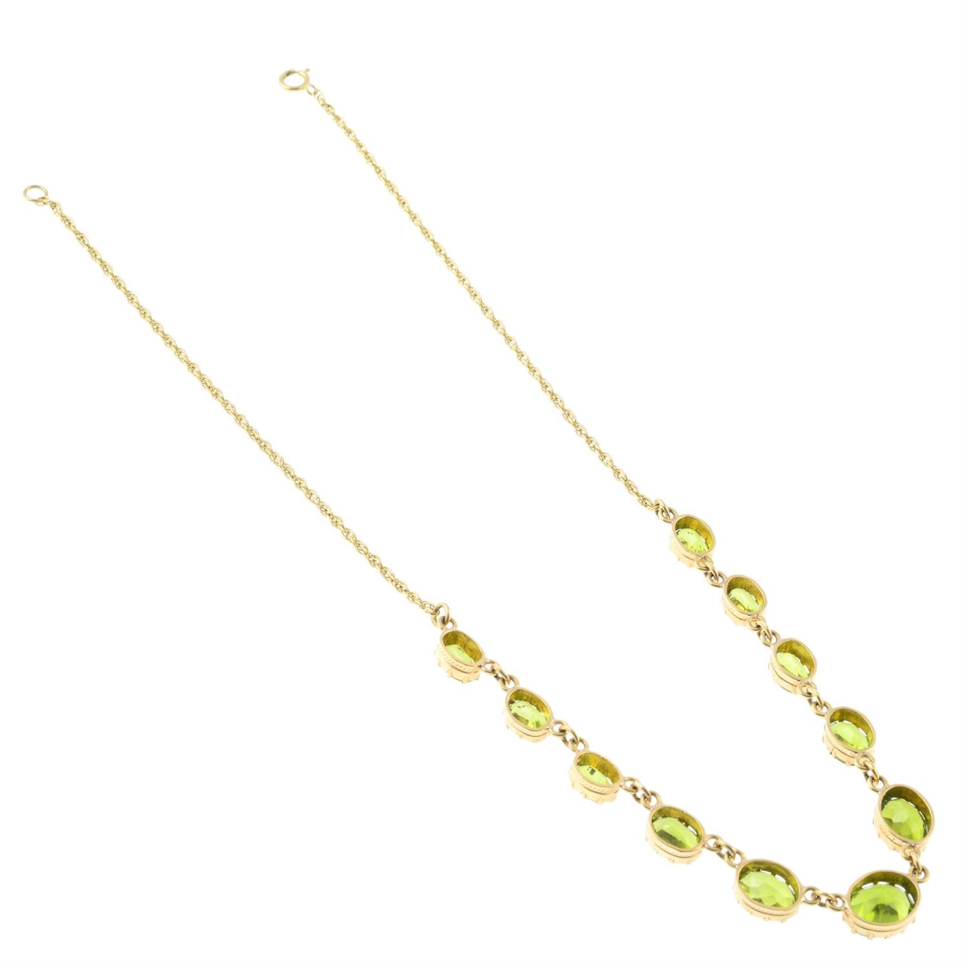 A 9ct gold peridot rivière necklace. - Image 2 of 2