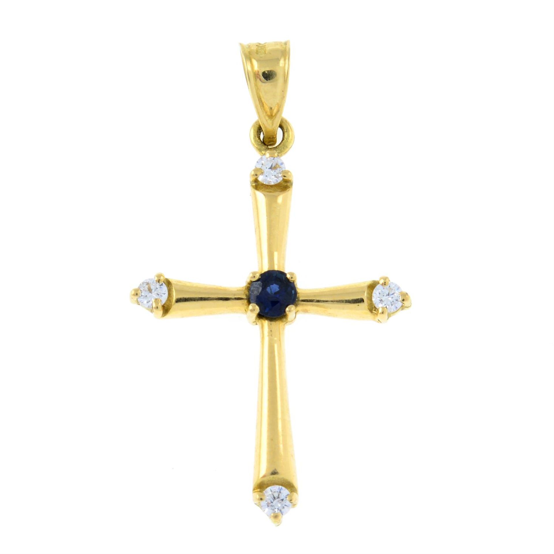 A brilliant-cut diamond and sapphire cross pendant.