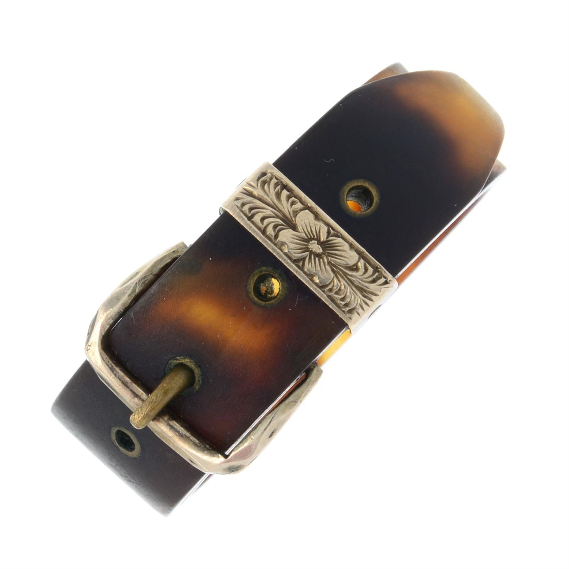 An early 20th century tortoiseshell floral buckle scarf ring.
