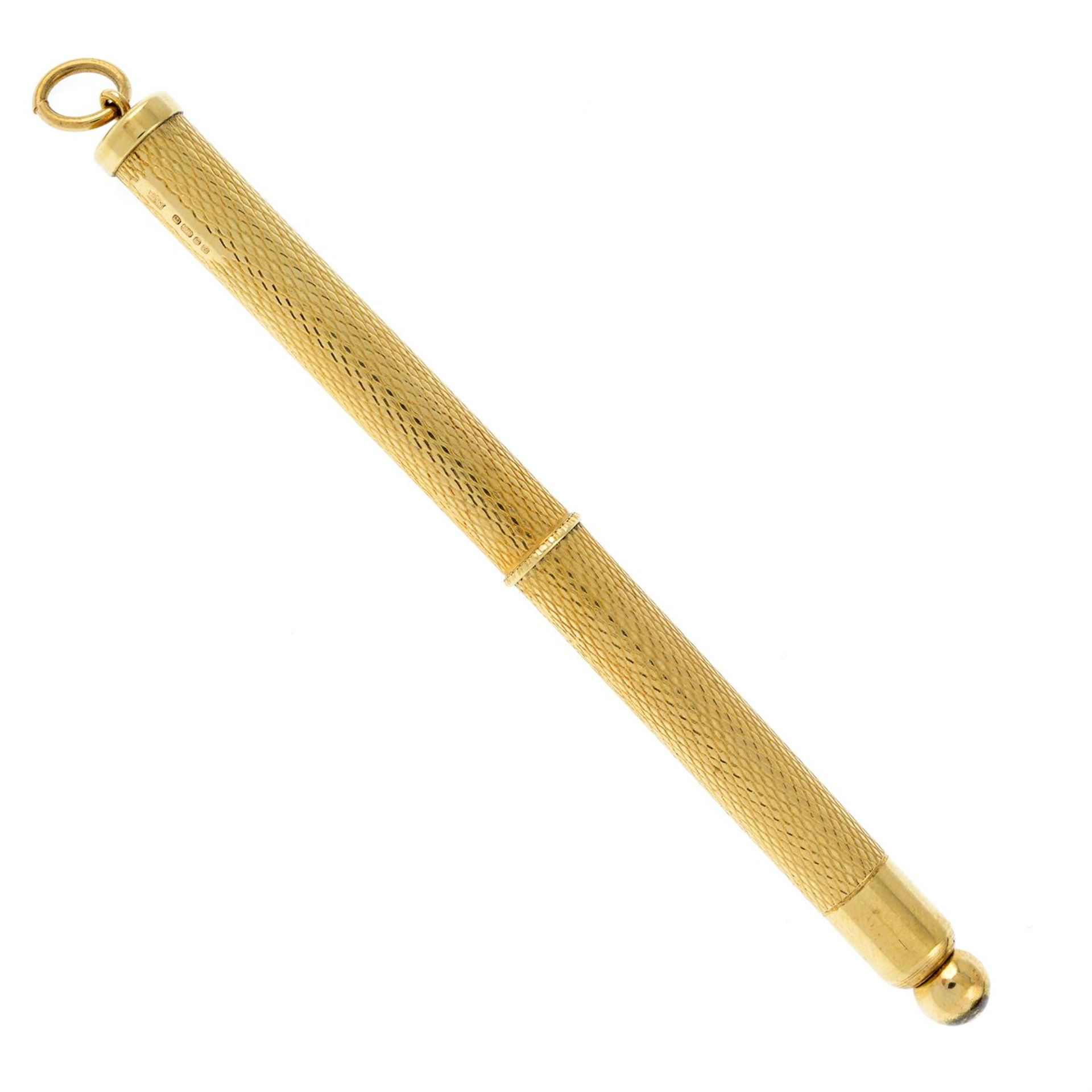 A 9ct gold swizzle stick.