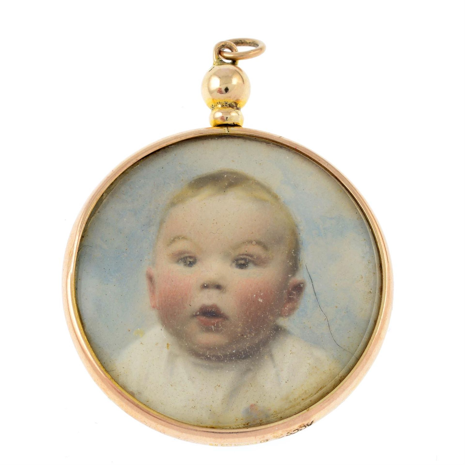 An early 20th century 9ct gold locket, containing a photograph and a portrait miniature.