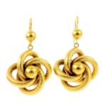 A pair of textured knot earrings.