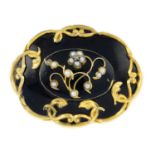 A late 19th century seed pearl and black enamel floral mourning brooch, with glazed panel reverse.