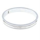 A silver bangle, by Mont Blanc.