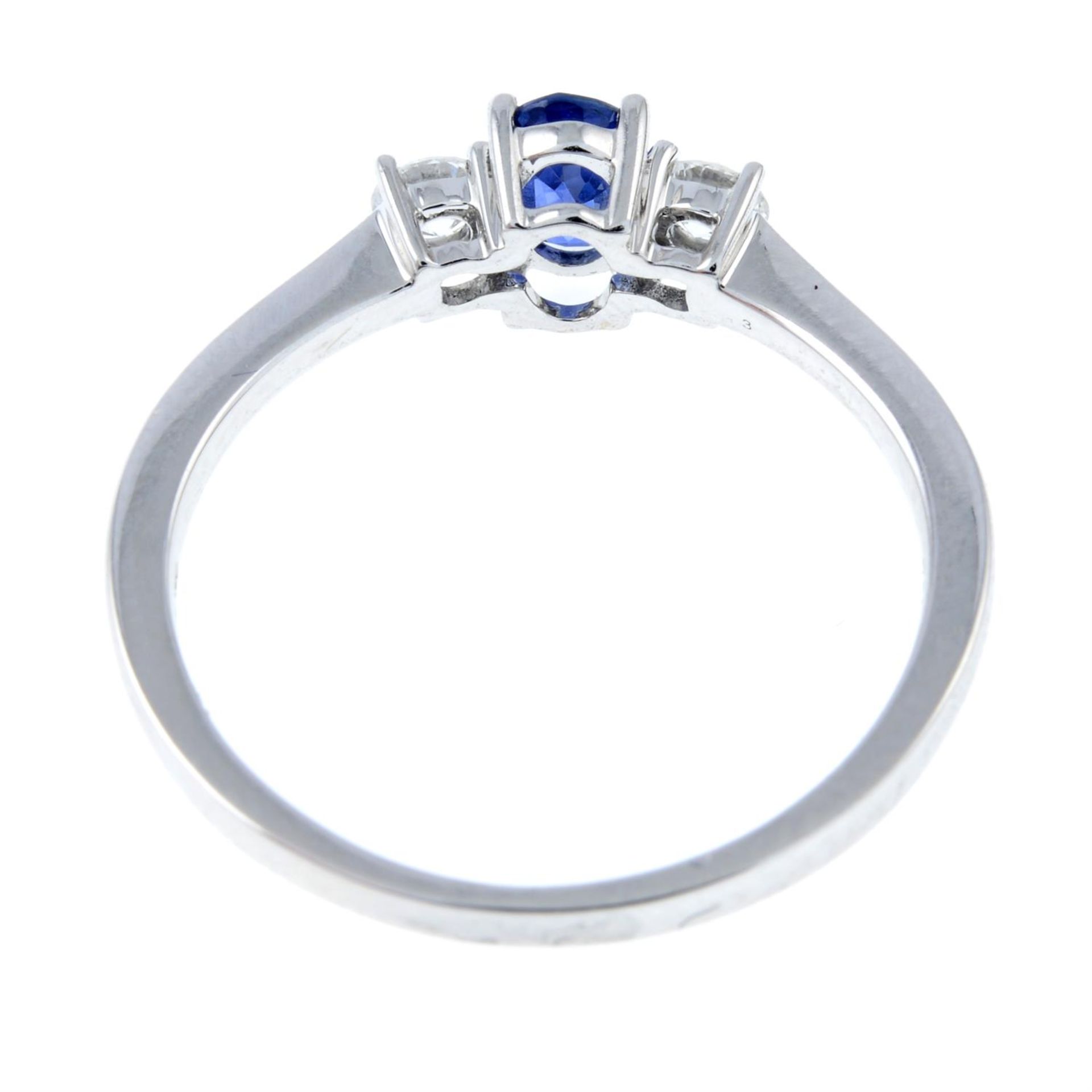 An 18ct gold sapphire and diamond three-stone ring. - Image 2 of 2