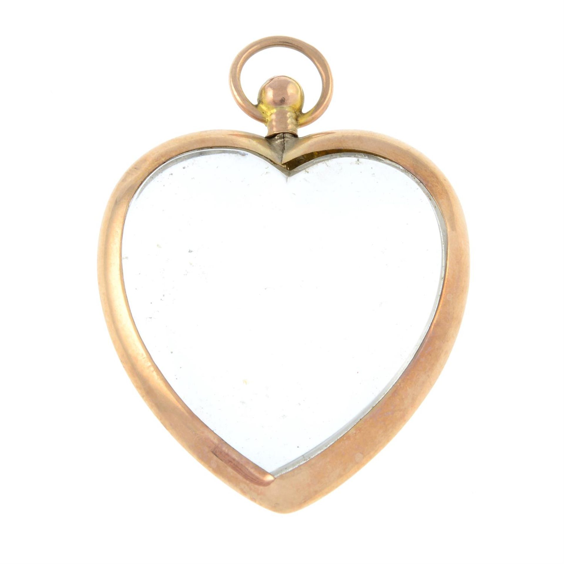 An early 20th century 9ct gold heart double sided locket.