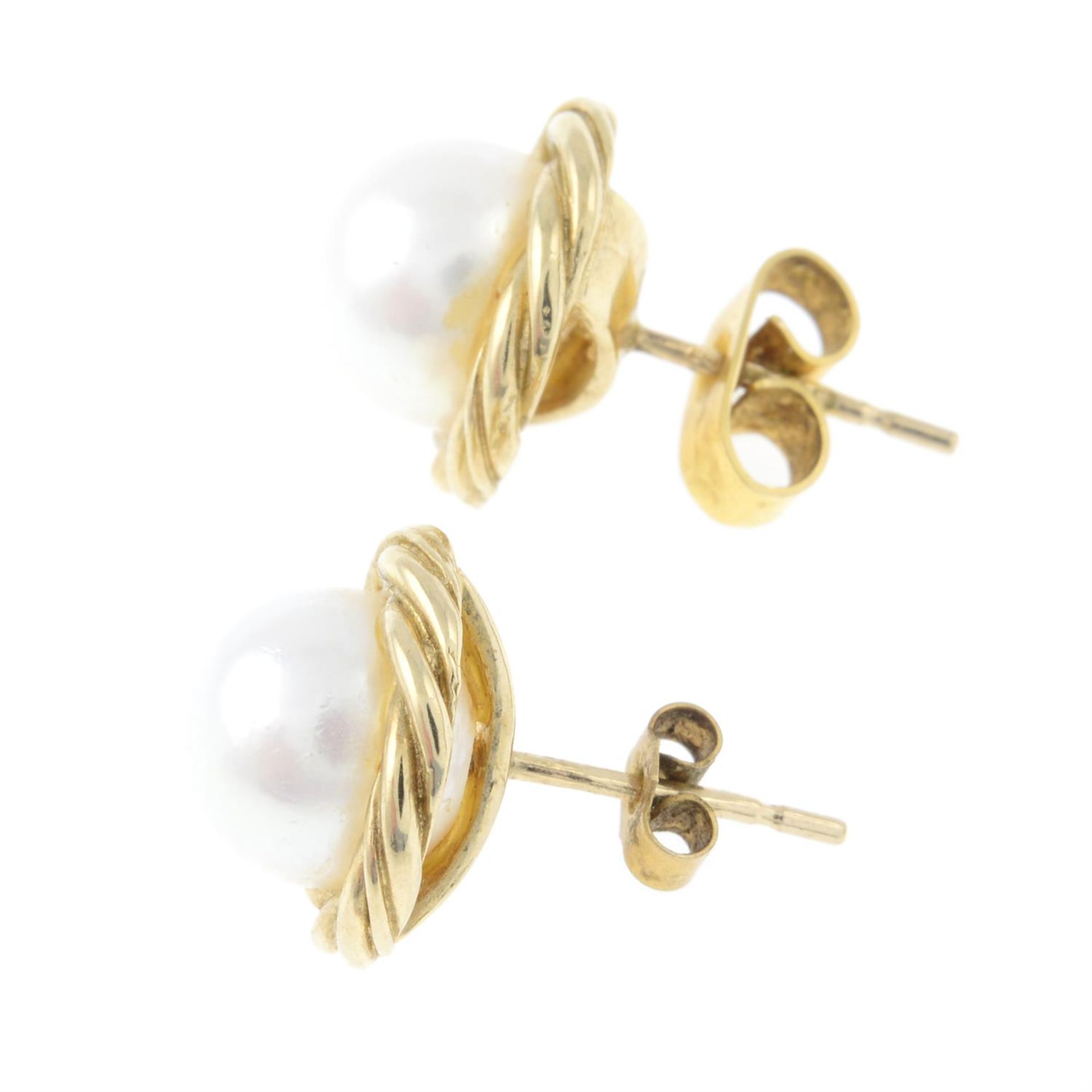 A pair of 9ct gold cultured pearl stud earrings. - Image 2 of 2