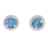 A pair of 'blue' diamond and diamond cluster stud earrings.