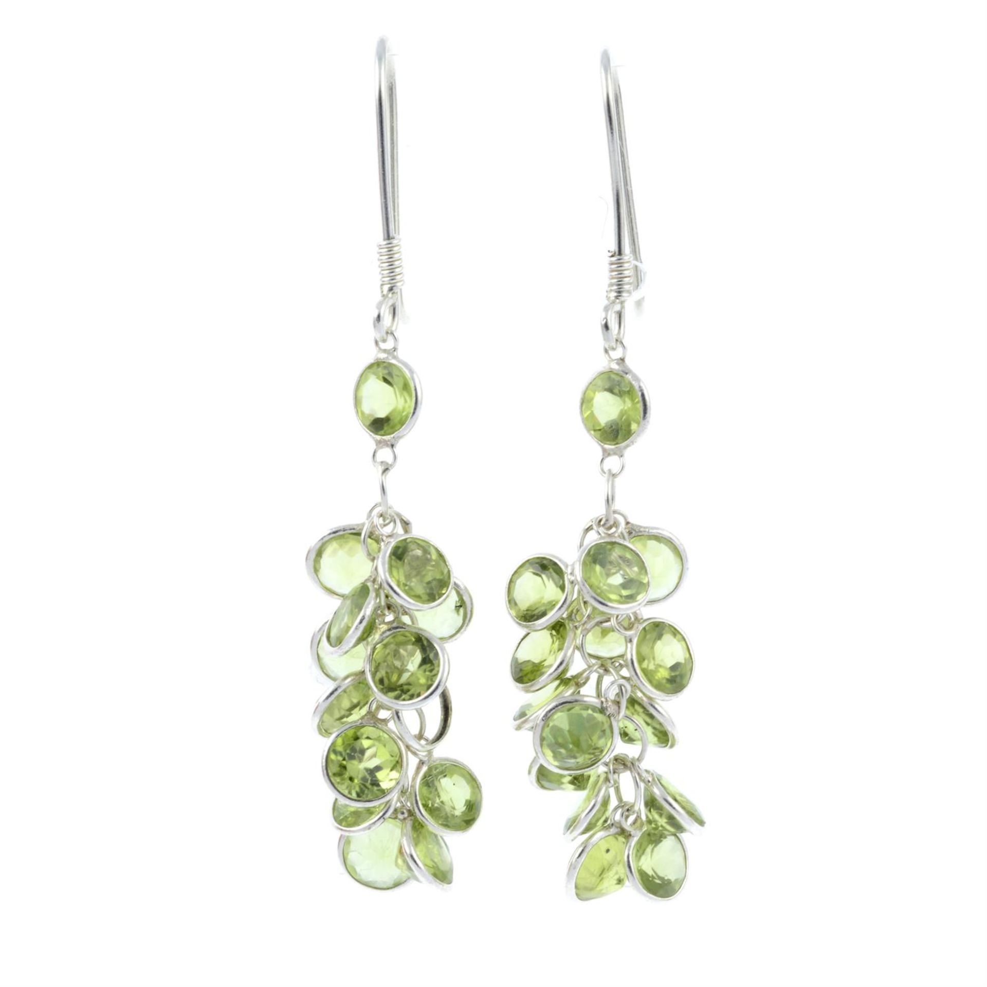 A pair of peridot drop earrings.