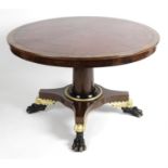 A William IV mahogany circular snap top table.