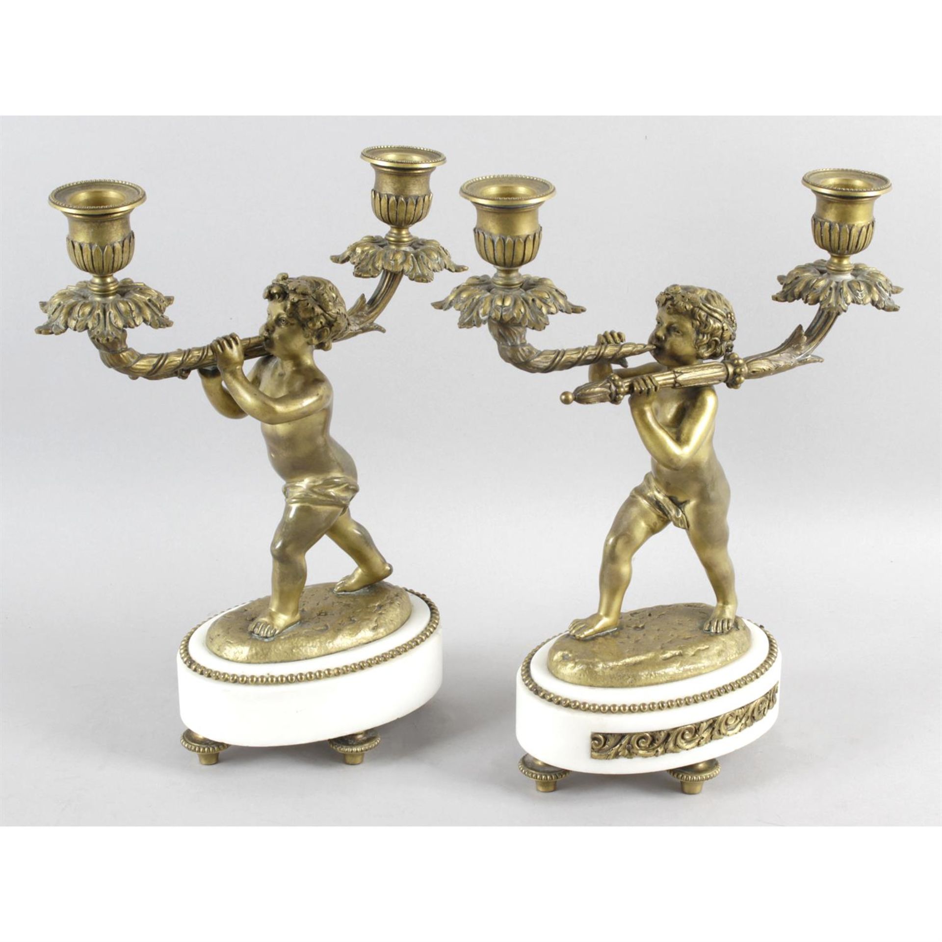 A pair of late 19th century gilt bronze candle holders.