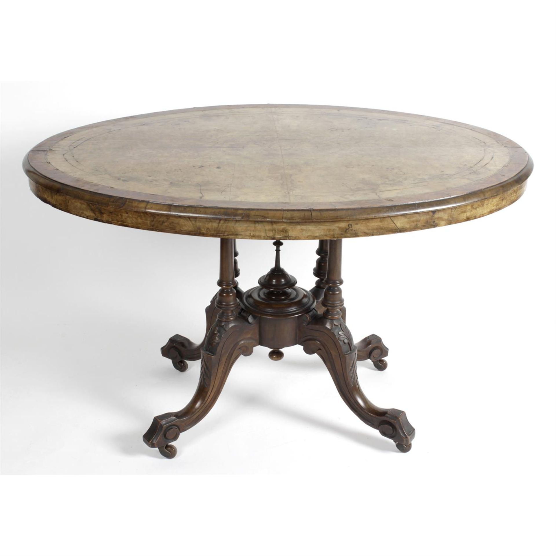 A large 19th century walnut veneered oval topped table.