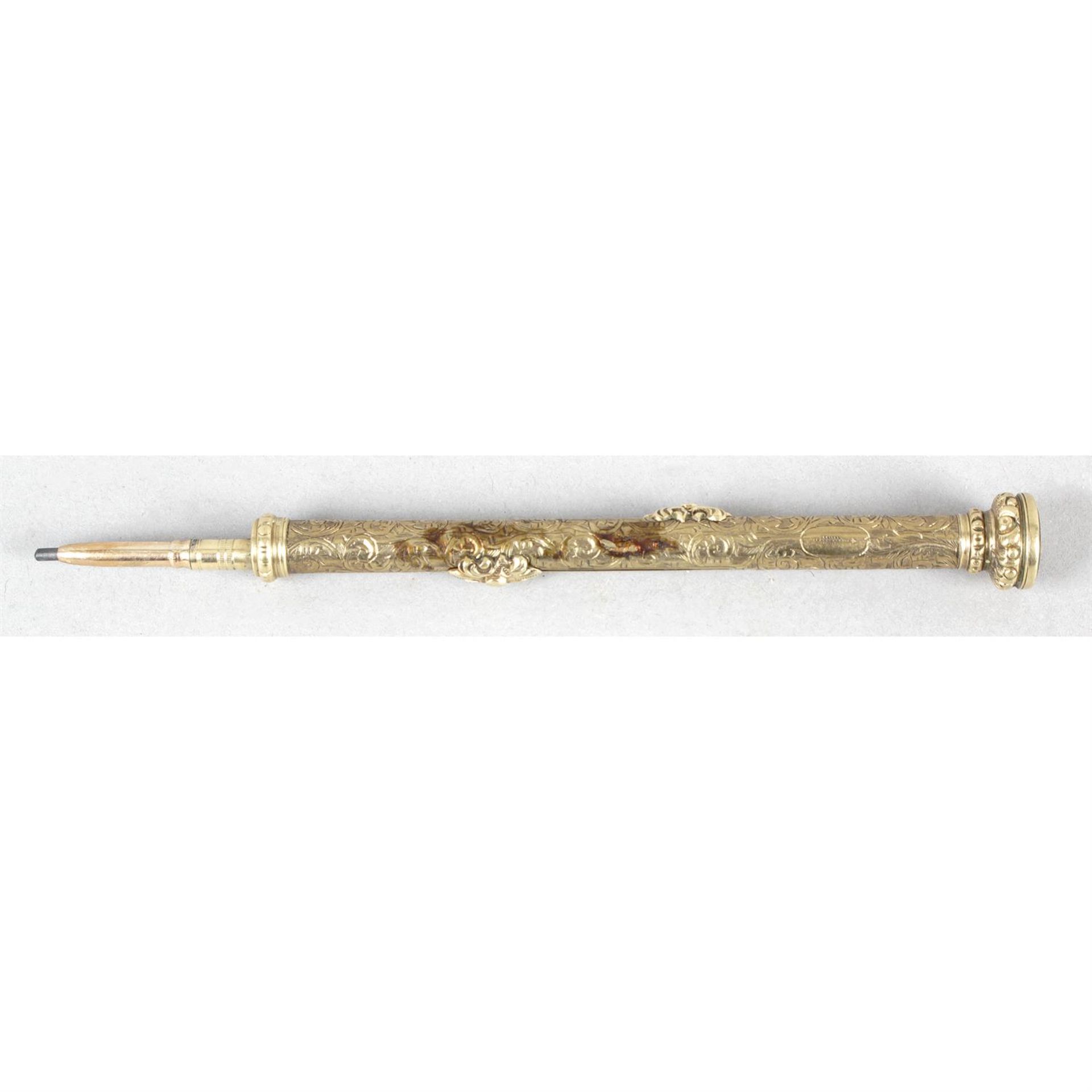 An antique gold cased combination fountain pen and propelling pencil.