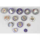 A collection of 14 enameled vintage coins.