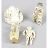 A late 19th century Oriental carved ivory netsuke, with carved ivory pendant