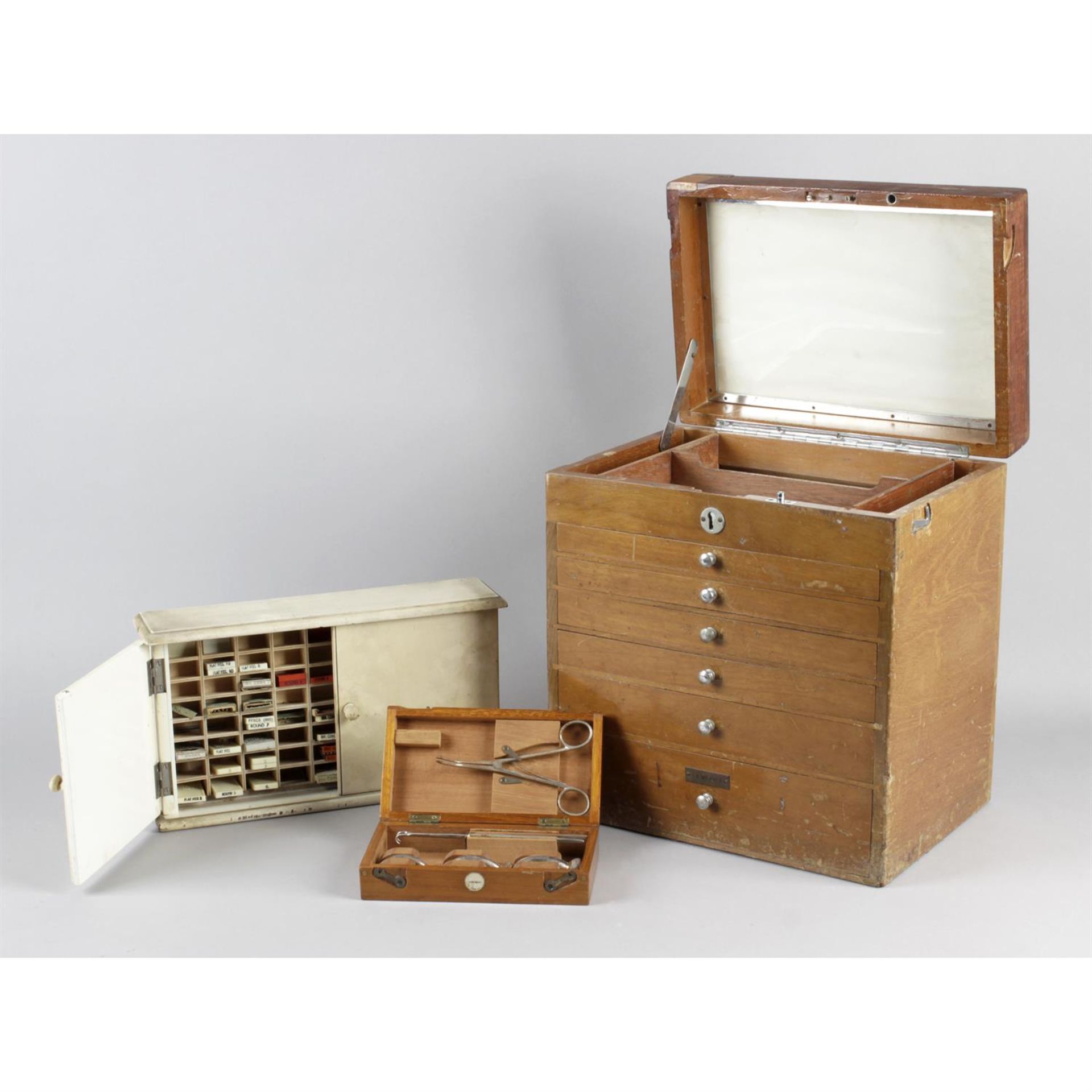 An old, leather cased 'doctors' travel case, with additional medical and dentistry equipment.