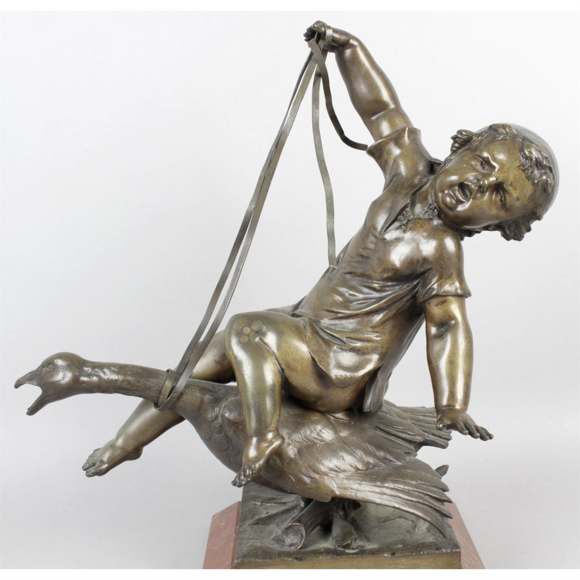 Dinee, a bronze figure group modelled as a young child seated on goose. - Image 2 of 5
