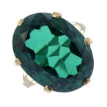 A green paste single-stone ring.