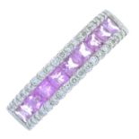 A diamond and pink sapphire half eternity ring.