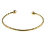 A 9ct gold cuff bangle.