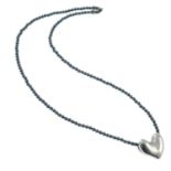 A heart pendant, with hematite bead necklace, by Allan Scharff for Georg Jensen.
