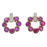 A pair of single-cut diamond and ruby stylised stud earrings.