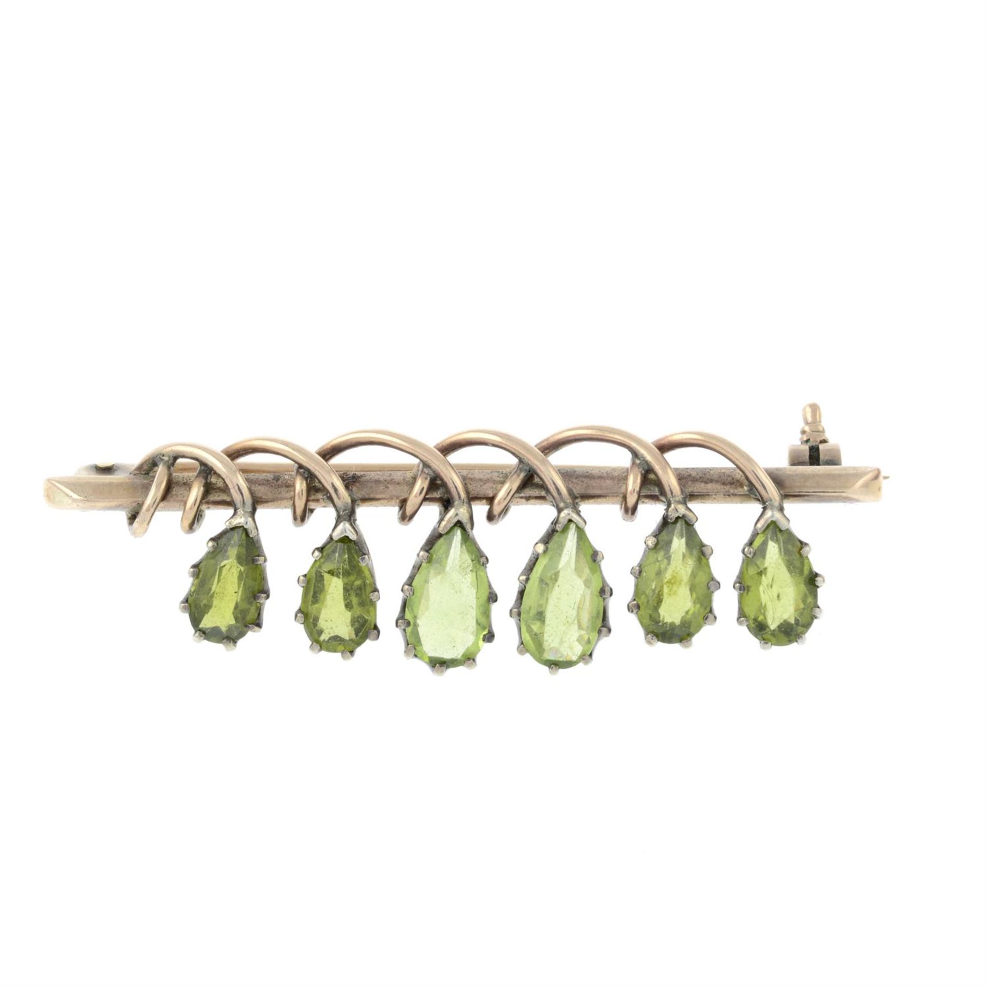 An Arts and Crafts peridot brooch, attributed to Dorrie Nossiter.