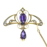 An Art Nouveau 9ct gold amethyst and split pearl brooch.