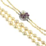 A mid 20th century cultured pearl two strand necklace, with 14ct gold ruby and cultured pearl clasp.