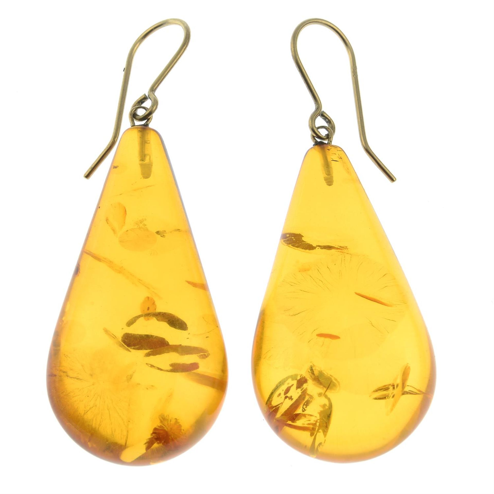 A pair of amber drop earrings.