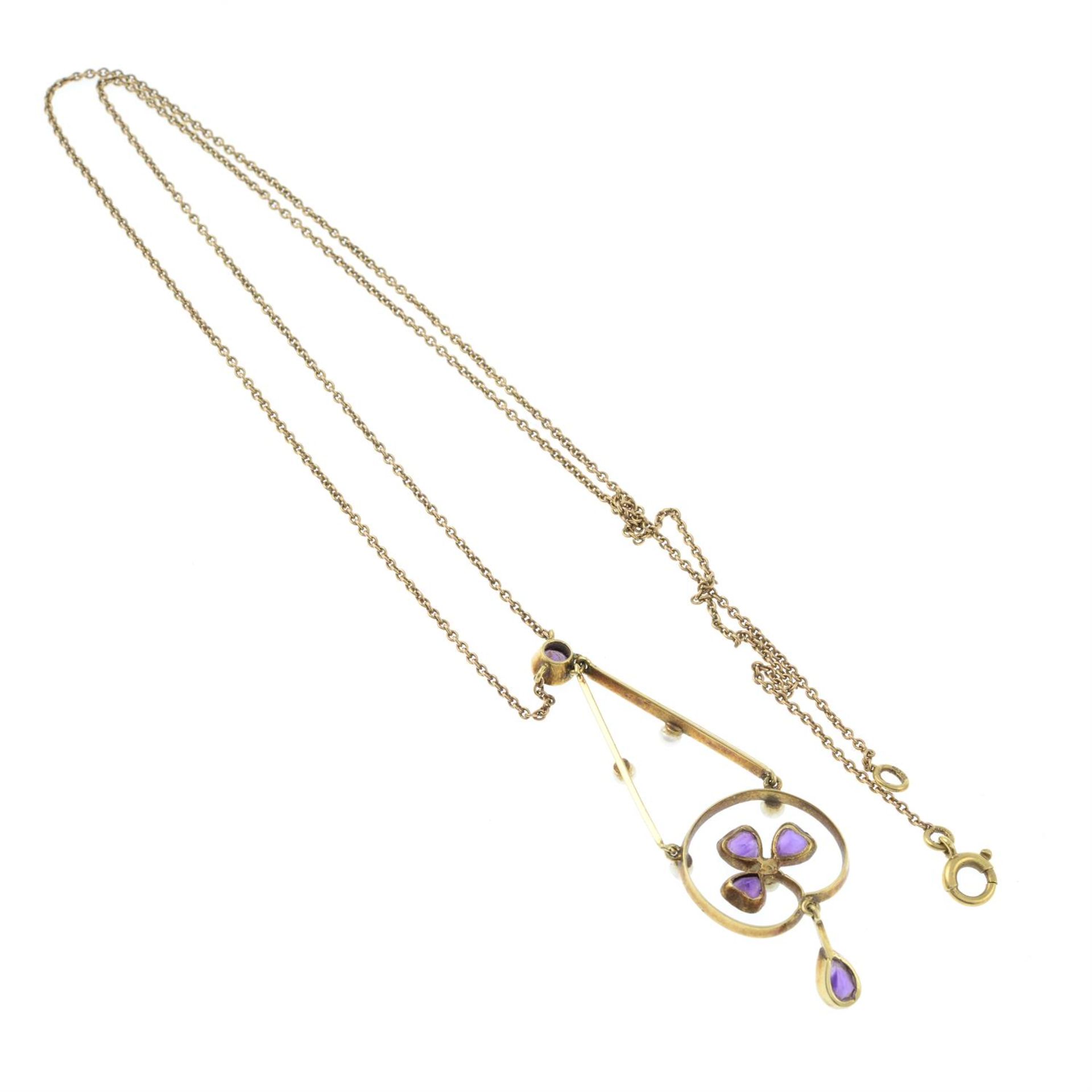 An early 20th century gold amethyst and seed pearl foliate pendant, on integral chain. - Image 2 of 2