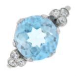 A blue zircon single-stone ring, with brilliant-cut diamond trefoil shoulders.