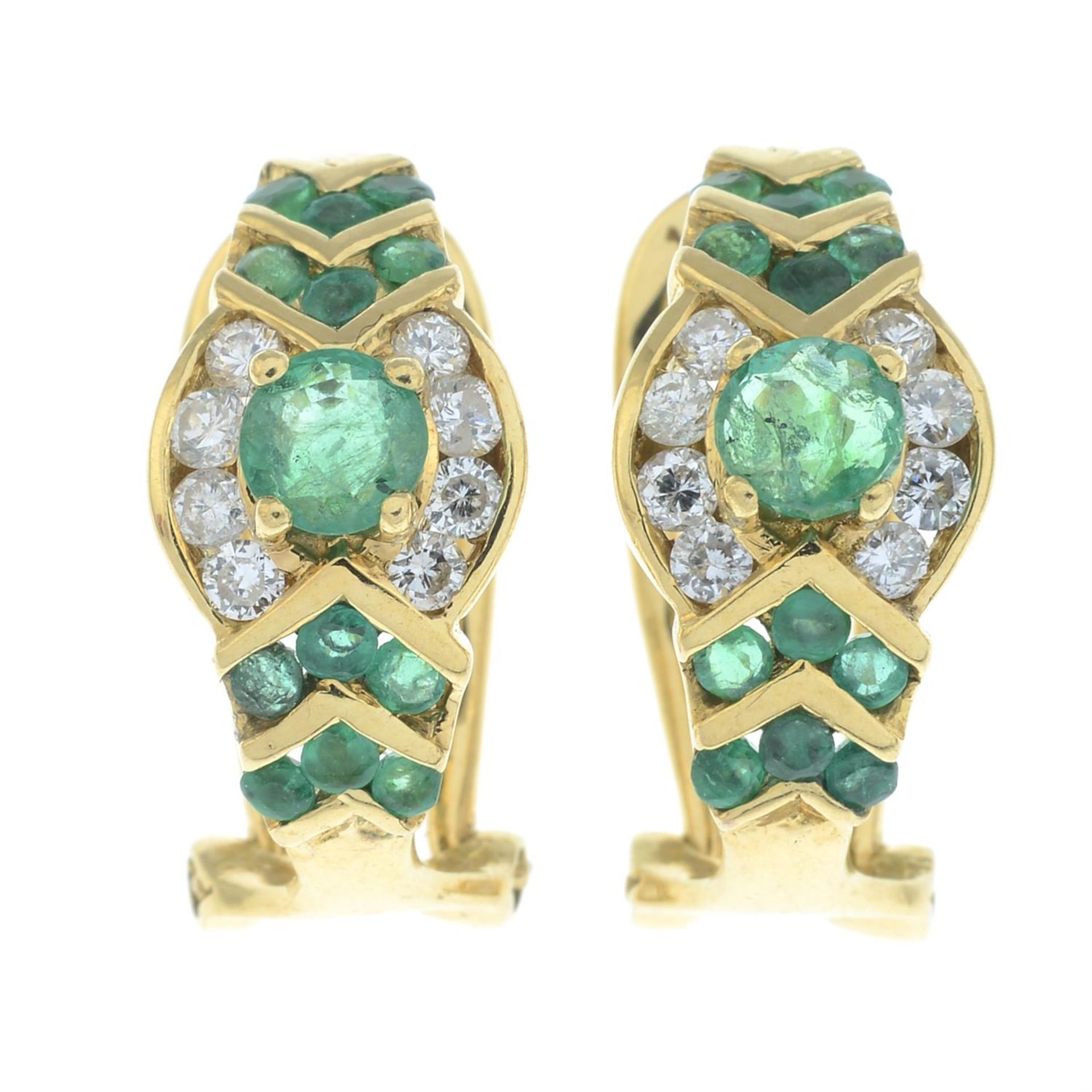 A pair of 18ct gold round-shape emerald and brilliant-cut diamond hinge-back stud earrings.