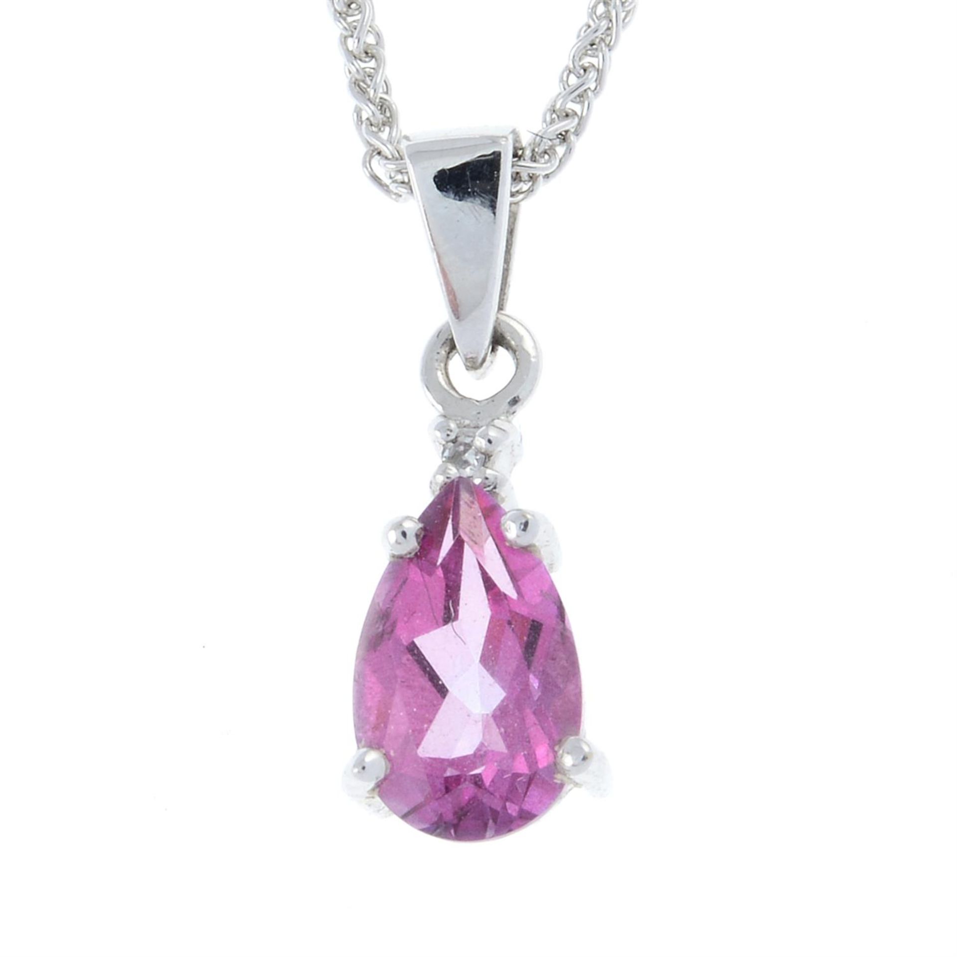 A pink sapphire and diamond pendant with chain.