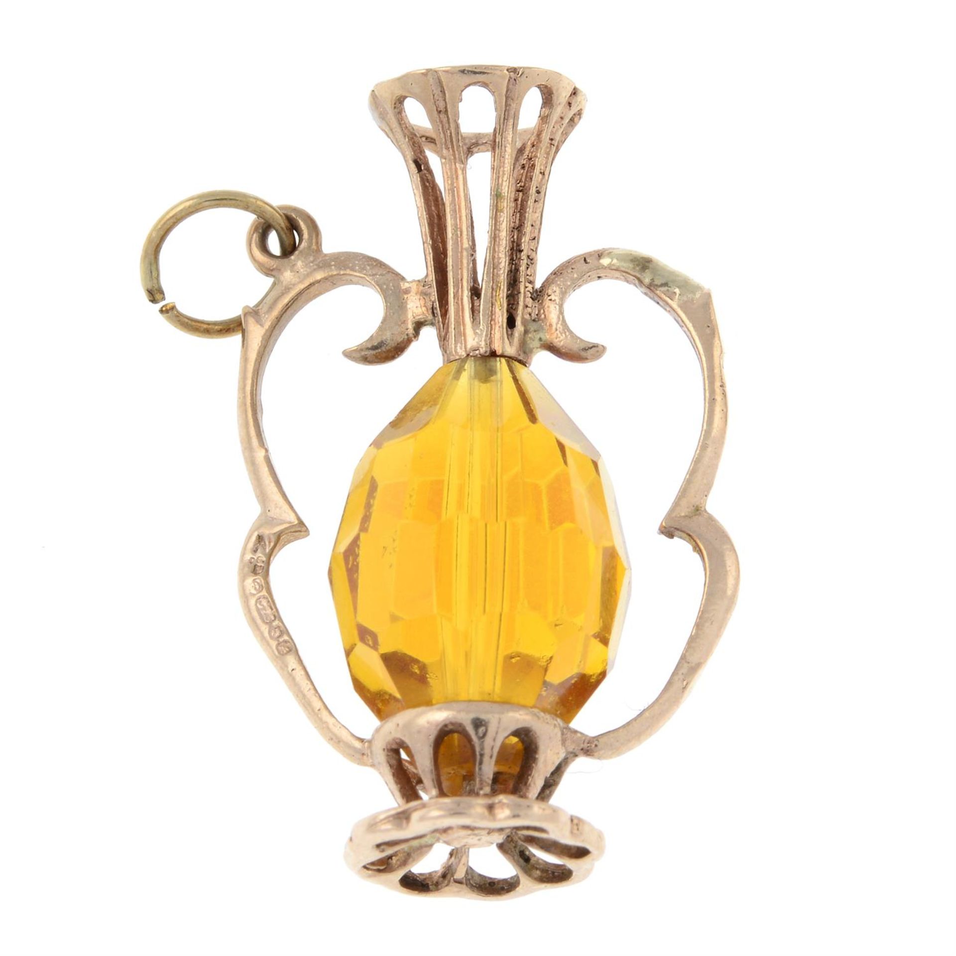 A 9ct gold coated paste vase charm.