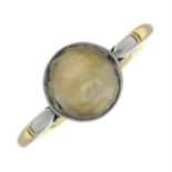 An early 20th century bi-colour 18ct gold mother-of-pearl ring.