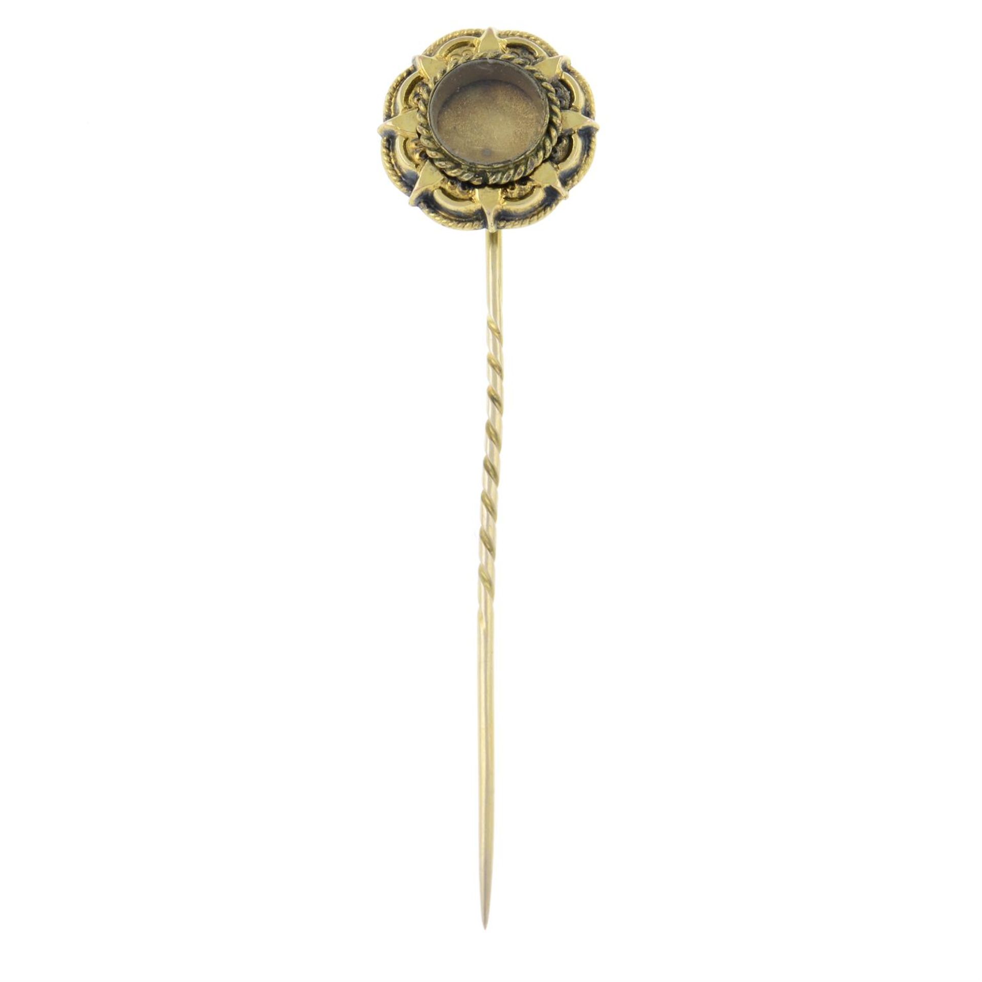 A late 19th century gold mourning locket stickpin.