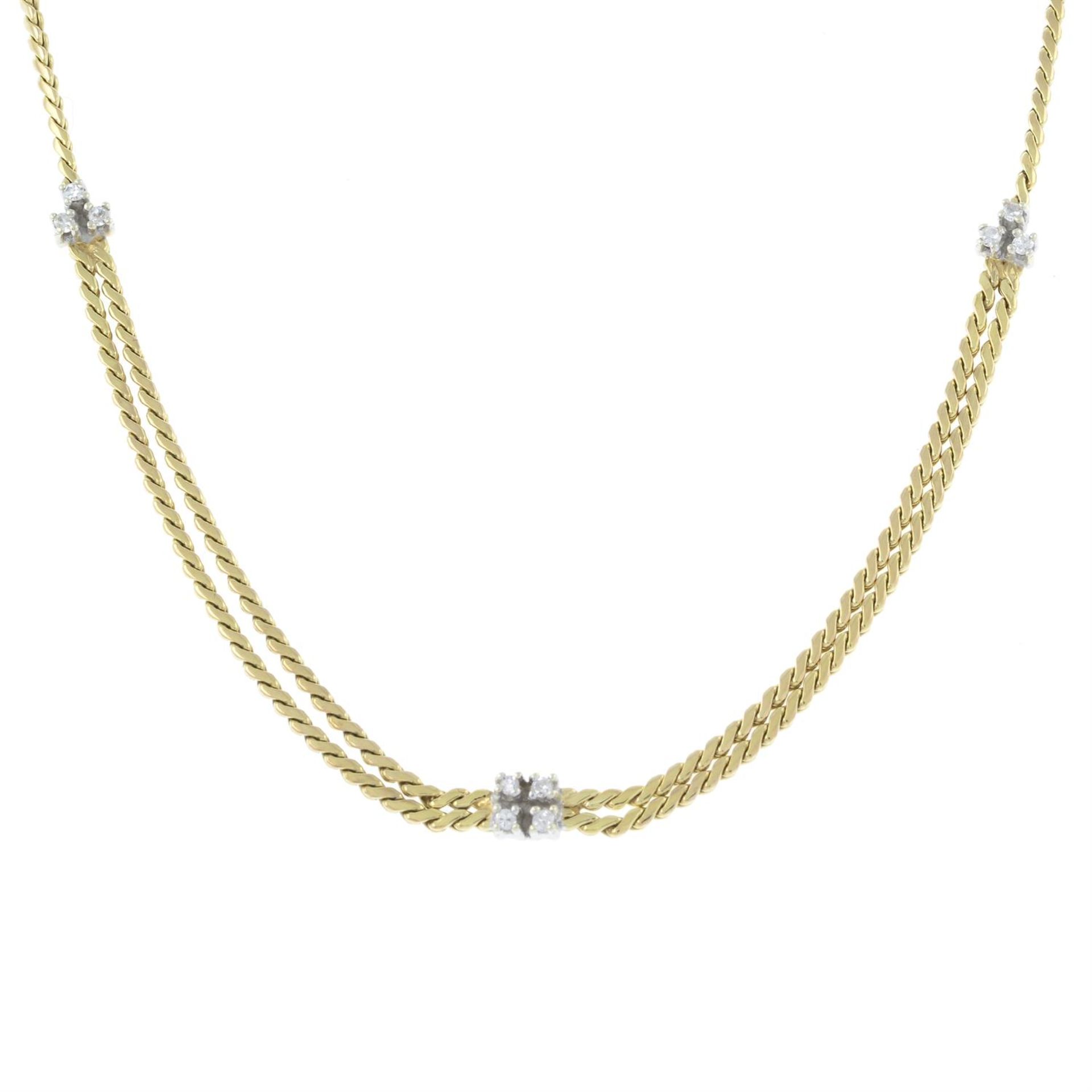 A 9ct gold single-cut diamond accent necklace, with added extension chain.