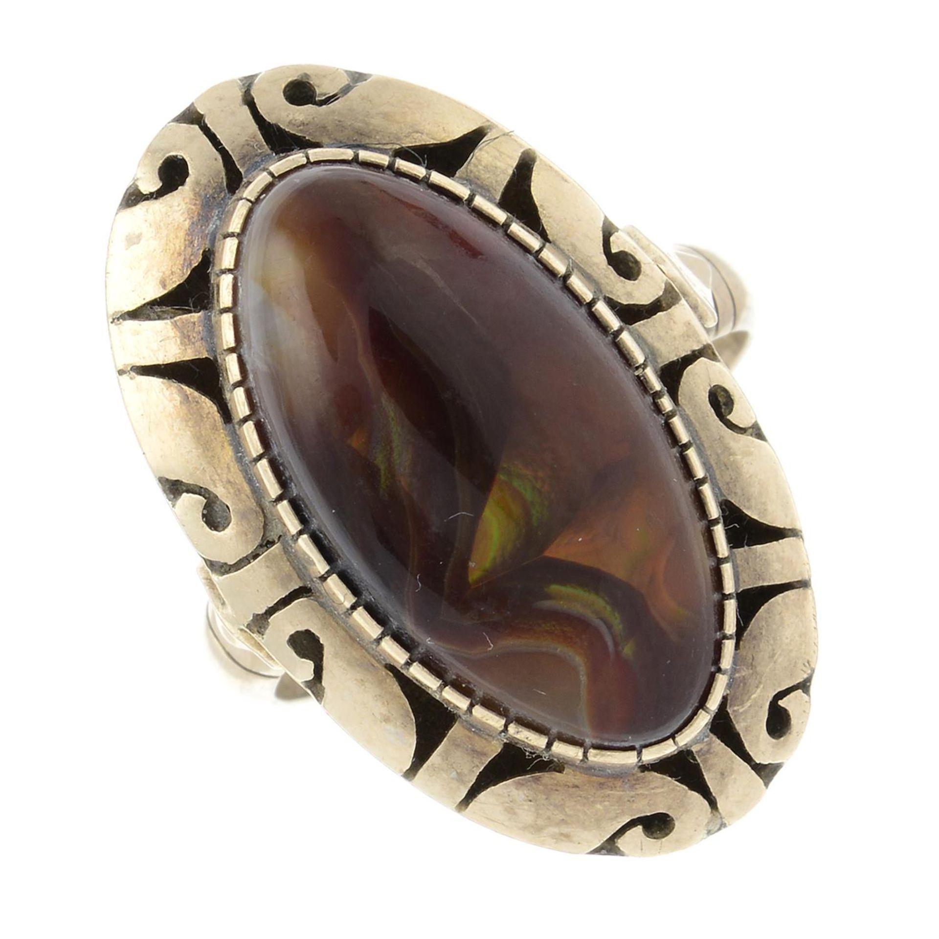 A fire agate single-stone dress ring.