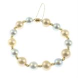 A vari-hue cultured pearl bracelet, with textured spacers.