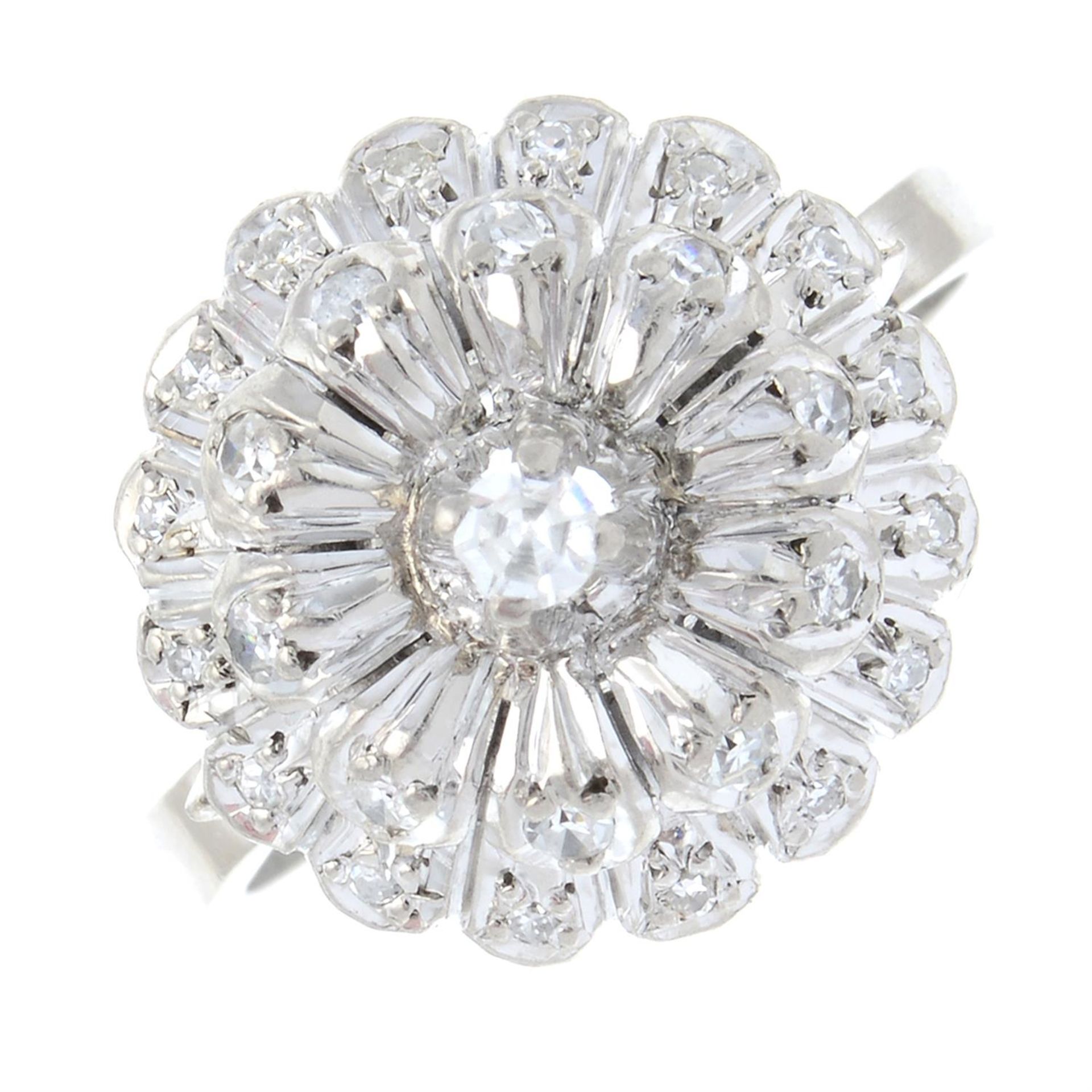 A single-cut diamond floral cluster ring.