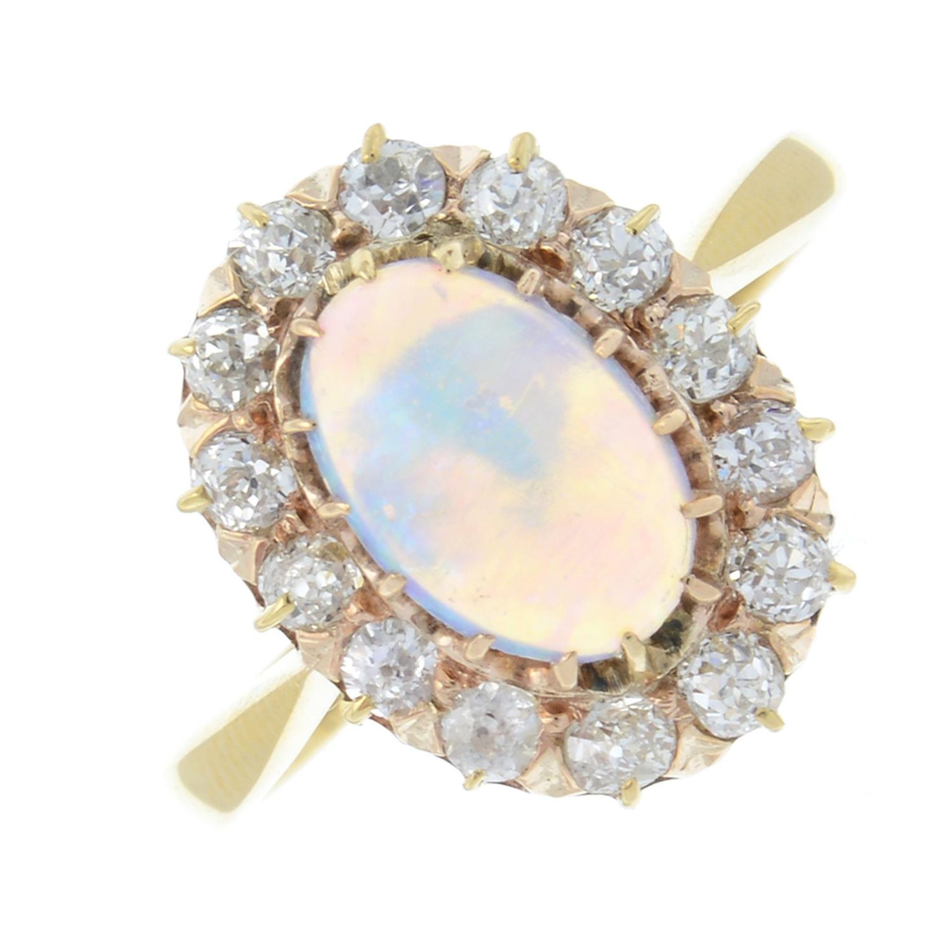 An 18ct gold opal cabochon and old-cut diamond cluster ring.