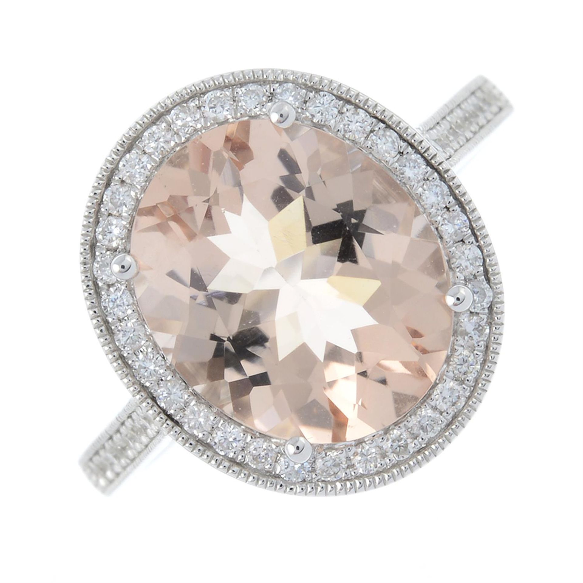 An 18ct gold oval-shape morganite and brilliant-cut diamond cluster ring.